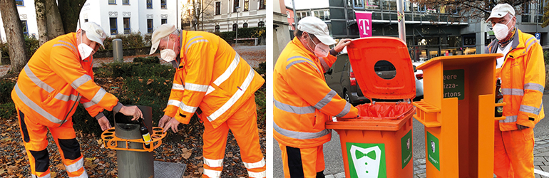 Zwei Mitarbeiter des Städtischen Betriebshofs beim Anbringen der Pfandring- und Pfandflaschenhalter. Bild: Stadt Kempten